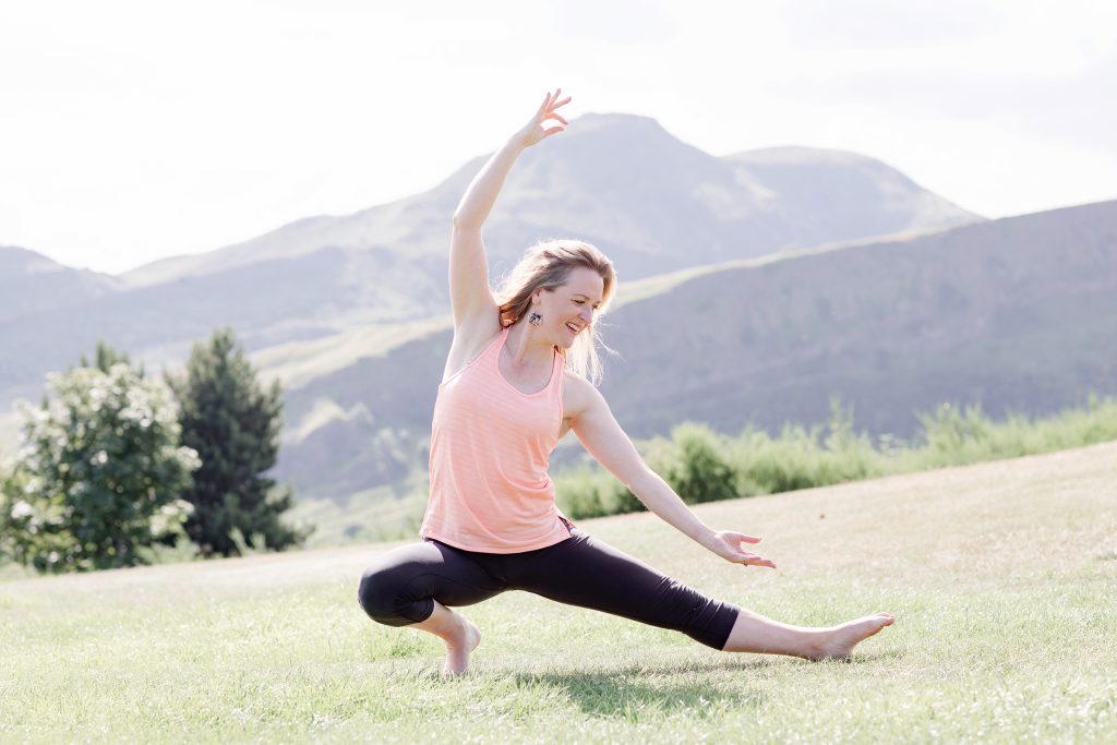 lady doing yoga on Calton Hill Edinburgh