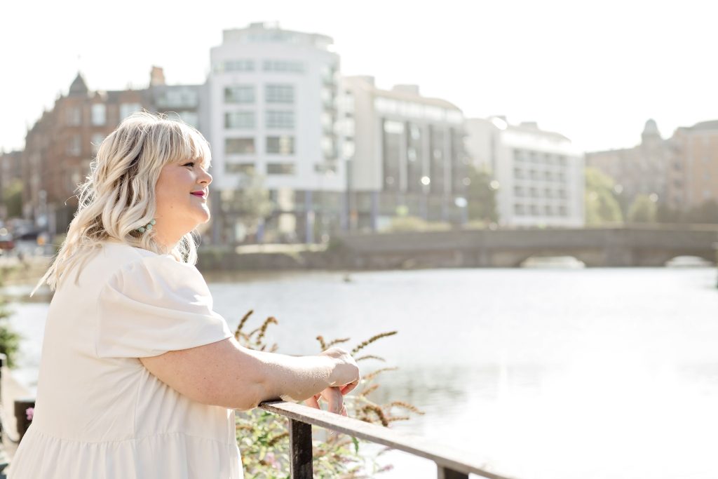 lady looking out over the water of leith in edinburgh