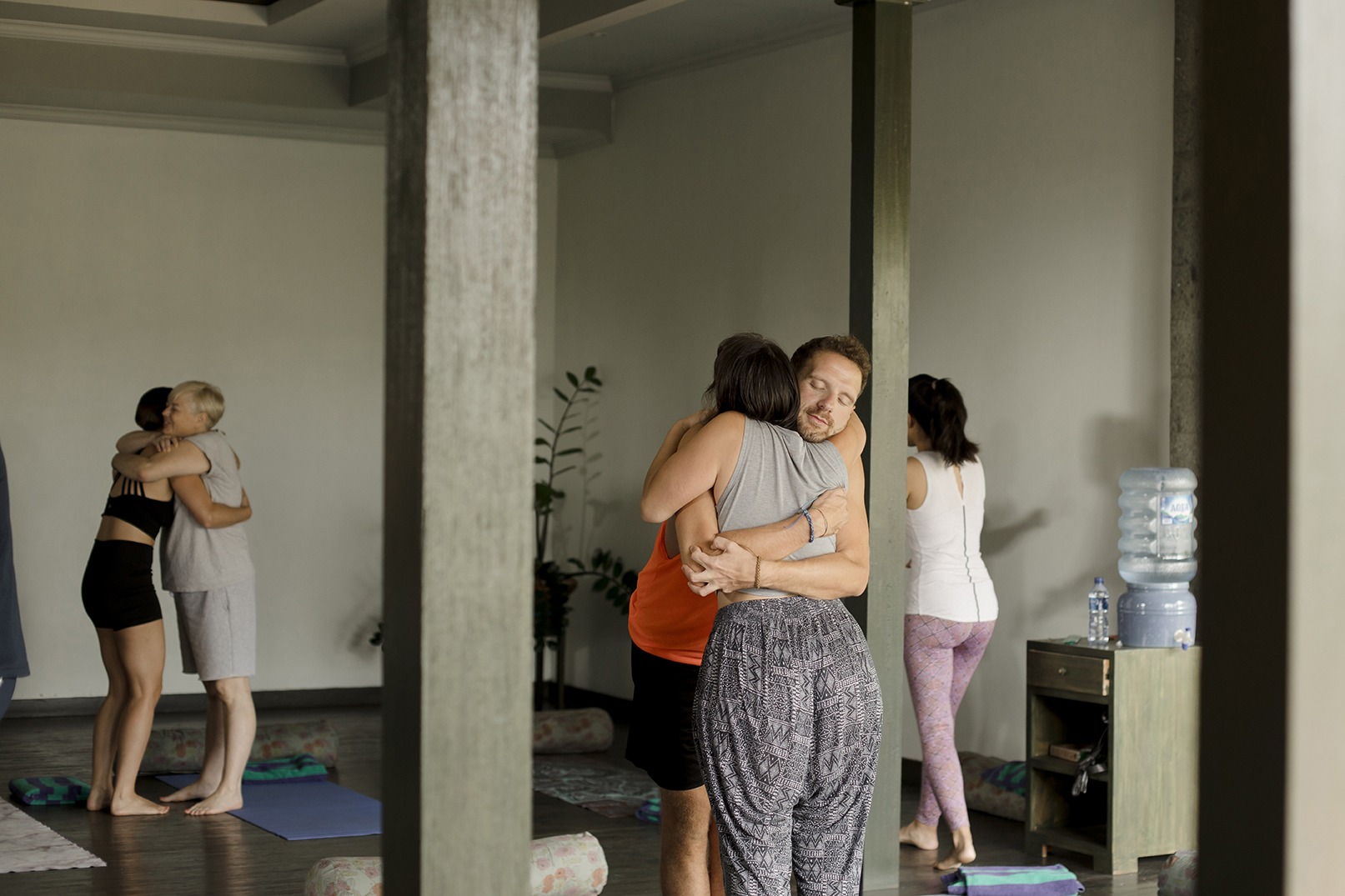 two people hug at a yoga retreat in bali